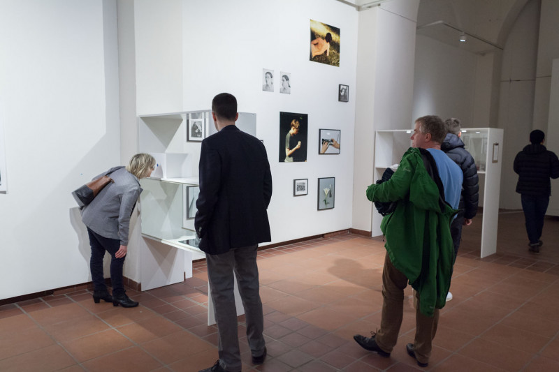 Exhibition view. Visitors look at the works of art