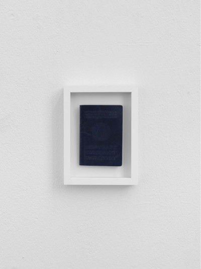 Passport with scratched-out golden inscription and scratched-out national emblem