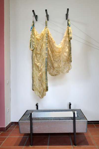 artificial gut hung over a steel water basin